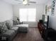 Living Room with sectional sofa, large window, and TV at 173 Megan Way, Cumberland, IN 46229