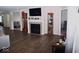 Living area with hardwood floors, fireplace, and built-in shelving at 173 Megan Way, Cumberland, IN 46229
