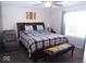 Spacious main bedroom with king-size bed and relaxing sitting area at 173 Megan Way, Cumberland, IN 46229