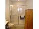 Clean shower with sliding glass doors and tiled floor at 173 Megan Way, Cumberland, IN 46229