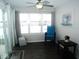Sunroom with hardwood floors, ceiling fan, and windows overlooking backyard at 173 Megan Way, Cumberland, IN 46229