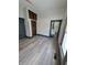 Primary bedroom with new flooring and ensuite bathroom at 1826 Tallman Ave, Indianapolis, IN 46218