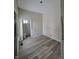 Spacious dining room with new flooring and adjacent bathroom at 1826 Tallman Ave, Indianapolis, IN 46218