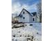 Side view of a white house with snowy yard at 1826 Tallman Ave, Indianapolis, IN 46218
