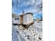 White sided home exterior with a yard covered in snow at 1826 Tallman Ave, Indianapolis, IN 46218