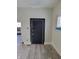 Dark brown door in a room with light gray walls at 1826 Tallman Ave, Indianapolis, IN 46218