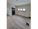 Living room with new floors and walls needing work at 1826 Tallman Ave, Indianapolis, IN 46218