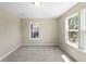 Bright bedroom with natural light from multiple windows and neutral carpet, offering a cozy atmosphere at 1833 Luther St, Indianapolis, IN 46203