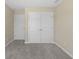 Bedroom with closet and neutral walls. The closet is visible and has double doors and plenty of room for storage at 1833 Luther St, Indianapolis, IN 46203