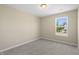 Neutral bedroom with carpet and large window provides natural light and a peaceful atmosphere for relaxation at 1833 Luther St, Indianapolis, IN 46203