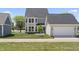 The backyard features a new lawn, house and garage at 1833 Luther St, Indianapolis, IN 46203