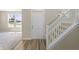 Bright foyer with white door, staircase, and views to the front yard at 1833 Luther St, Indianapolis, IN 46203