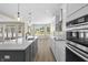 Bright, modern kitchen features an island, sleek countertops, stainless steel appliances, and ample natural light at 1833 Luther St, Indianapolis, IN 46203