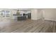 Modern kitchen with island, stainless steel appliances, and hardwood floors at 1833 Luther St, Indianapolis, IN 46203