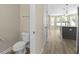 Open-concept design showcases a kitchen island, modern fixtures, and seamless flow into the home's living spaces at 1833 Luther St, Indianapolis, IN 46203