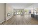 Spacious living room with wood floors, fireplace and bright windows at 1833 Luther St, Indianapolis, IN 46203