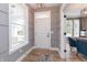 Welcoming entryway featuring wood floors, gray walls, and lots of natural light at 1837 Luther St, Indianapolis, IN 46203