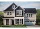 Two-story house with gray and dark green siding, and a two-car garage at 1837 Luther St, Indianapolis, IN 46203