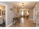 Hallway leading to a bathroom and living room, featuring art and desk at 1837 Luther St, Indianapolis, IN 46203