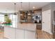 Stylish kitchen island, stainless steel appliances, and open floor plan at 1837 Luther St, Indianapolis, IN 46203