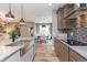 Open kitchen featuring stainless appliances and view into dining area at 1837 Luther St, Indianapolis, IN 46203