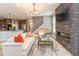 Open-concept living room with a fireplace, modern lighting, and adjoined to kitchen at 1837 Luther St, Indianapolis, IN 46203