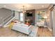 Inviting living room with a stone fireplace, modern lighting, and wood floors at 1837 Luther St, Indianapolis, IN 46203