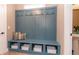 Mud room featuring a built-in bench with coat hooks, storage baskets, and natural light at 1837 Luther St, Indianapolis, IN 46203