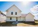 Backyard of a two-story home with white siding and a well-maintained lawn under a sunny sky at 1841 Luther St, Indianapolis, IN 46203