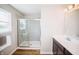 Bathroom with a glass-enclosed shower, tile floors, and vanity with modern lighting at 1841 Luther St, Indianapolis, IN 46203
