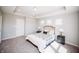 Bright main bedroom features a king bed, carpeted floors, and ample natural light from multiple windows at 1841 Luther St, Indianapolis, IN 46203