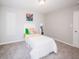 Bright bedroom features a white twin bed, carpeted floors, and fresh wall paint at 1841 Luther St, Indianapolis, IN 46203