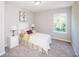 Cozy bedroom features a single bed, two nightstands, and a giraffe painting at 1841 Luther St, Indianapolis, IN 46203