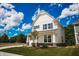 Beautiful two-story home with a lush green lawn and vibrant trees, showcasing a peaceful and inviting outdoor space at 1841 Luther St, Indianapolis, IN 46203