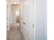 Hallway featuring a large closet with white doors and neutral carpet at 1841 Luther St, Indianapolis, IN 46203