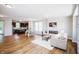 Bright, open-concept living area featuring modern fireplace, wood floors, and seamless transition to the kitchen at 1841 Luther St, Indianapolis, IN 46203