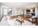 Spacious open-concept living area blending seamlessly with the kitchen, featuring wood floors and ample natural light at 1841 Luther St, Indianapolis, IN 46203