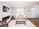 Elegant living room featuring a modern fireplace, comfortable seating, and a welcoming ambiance with a 'Welcome' sign at 1841 Luther St, Indianapolis, IN 46203