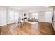 Bright and airy living room with wood floors, featuring a cozy seating area and a smooth transition to the dining space at 1841 Luther St, Indianapolis, IN 46203