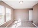 Bright bedroom with plush carpeting, a large window with a view, and a closet at 1902 Zwingley St, Indianapolis, IN 46203