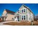 A lovely two story home with beautiful landscaping. The home is green with white trim at 1902 Zwingley St, Indianapolis, IN 46203