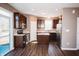Modern kitchen with dark cabinetry, stainless steel appliances, and an island with a marble top at 1902 Zwingley St, Indianapolis, IN 46203