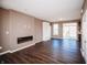 Bright living room with sleek fireplace, hardwood floors, and an open floor plan at 1902 Zwingley St, Indianapolis, IN 46203