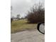 Vacant lot with sparse vegetation, located near residential area at 1902 Zwingley St, Indianapolis, IN 46203