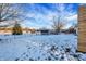 Snowy backyard with storage shed and fence at 1915 Glendora Dr, Indianapolis, IN 46214