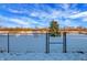 Fenced backyard with snow and open space at 1915 Glendora Dr, Indianapolis, IN 46214