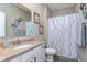 Clean bathroom with shower/tub combo, vanity, and mirror at 1962 Fairmount Dr, Greenfield, IN 46140