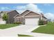 House exterior with white garage door and landscaping at 1962 Fairmount Dr, Greenfield, IN 46140