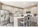 Modern kitchen with stainless steel appliances, white countertops, and a center island at 2010 Rhettsbury St, Carmel, IN 46032