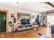Living room with large fish art and hardwood floors at 2230 E 75Th St, Indianapolis, IN 46240